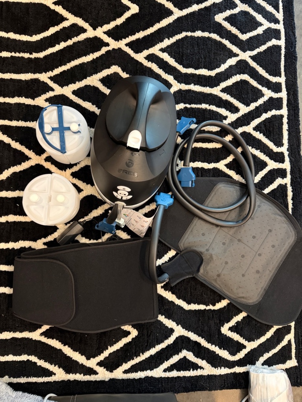 Breg V-Pulse Ice Machine for back with an extra ice canister.